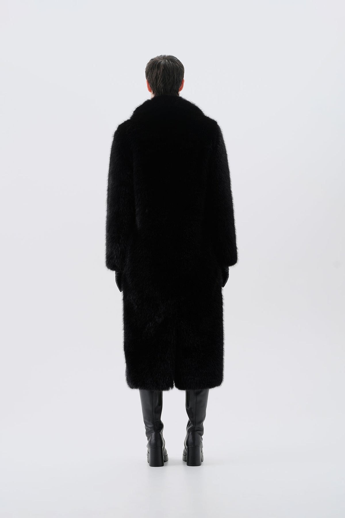 Long black faux fur coat, back view