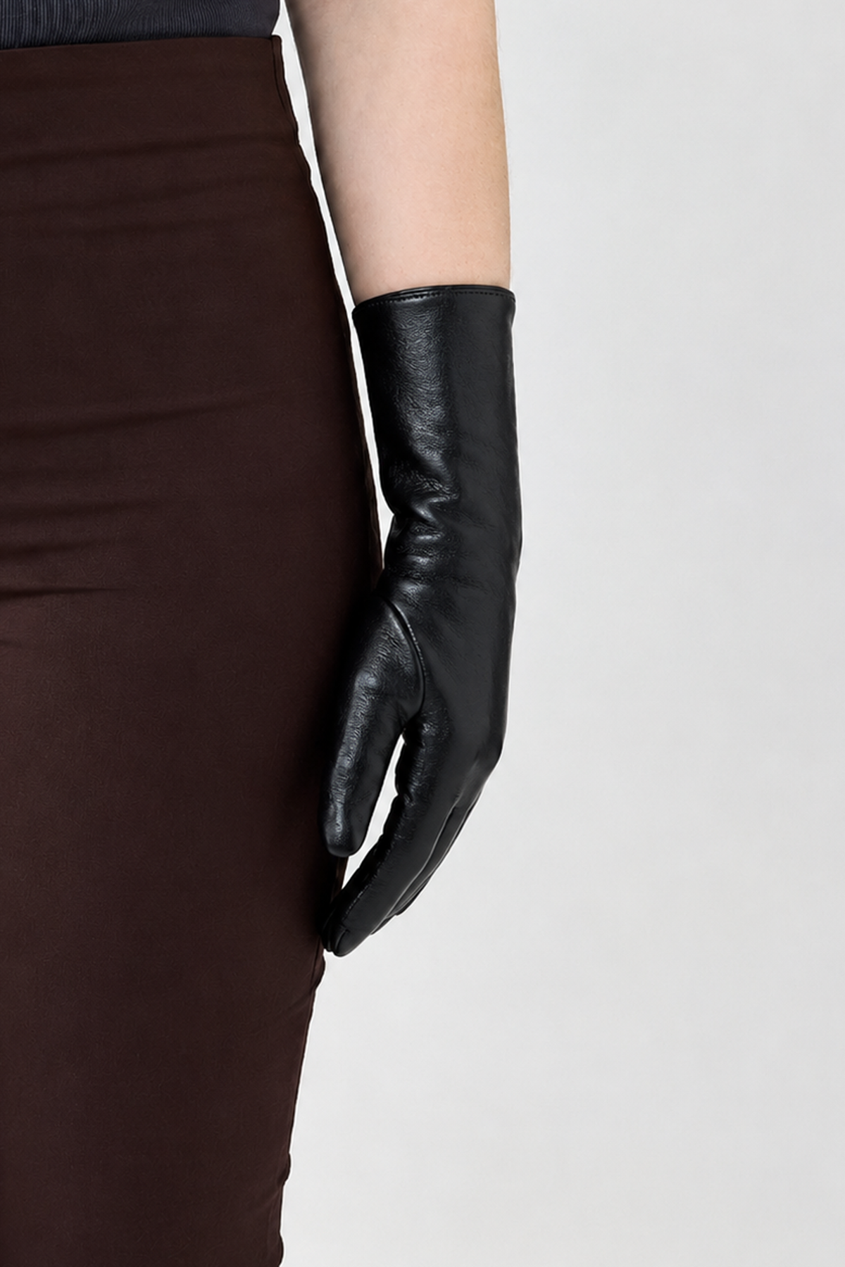 Vegan black leather glove on a white background