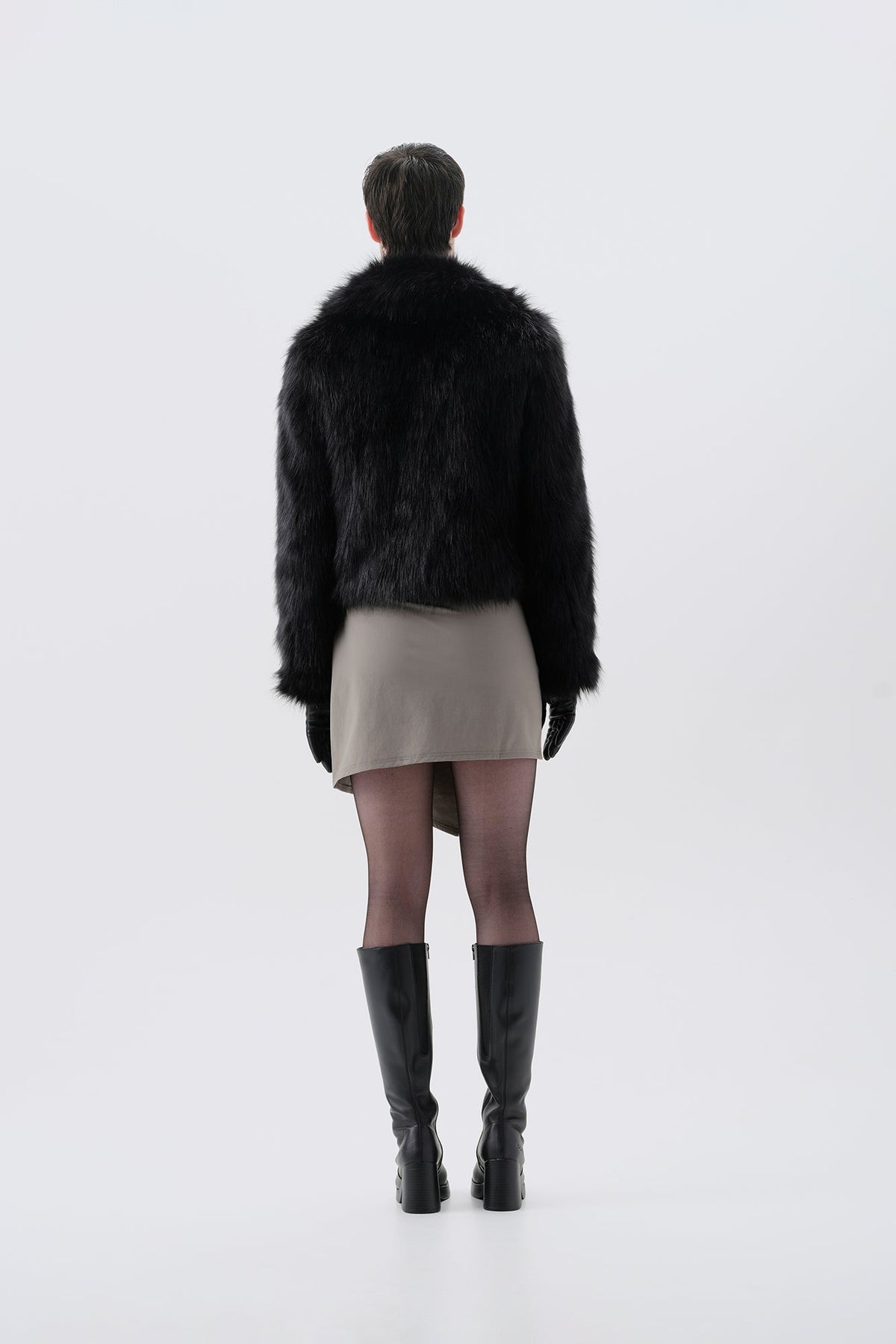 Cropped black faux fur jacket, back view