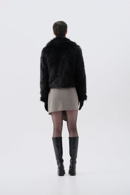 Cropped black faux fur jacket, back view