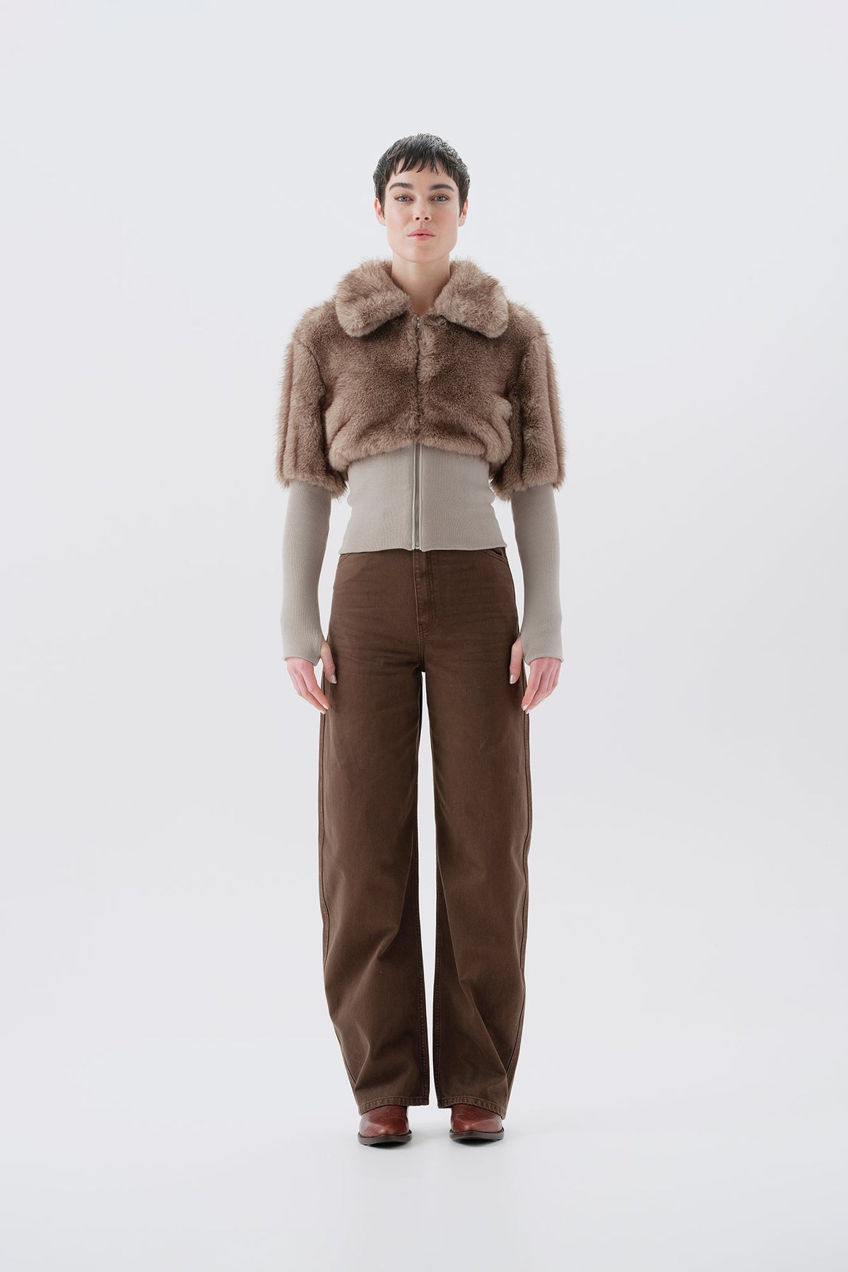 Cropped beige and gray faux fur jacket with statement collar and ribbed knit trim at waist and cuffs, front view