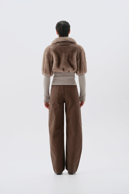 Cropped beige and gray faux fur jacket with statement collar and ribbed knit trim at waist and cuffs, back view