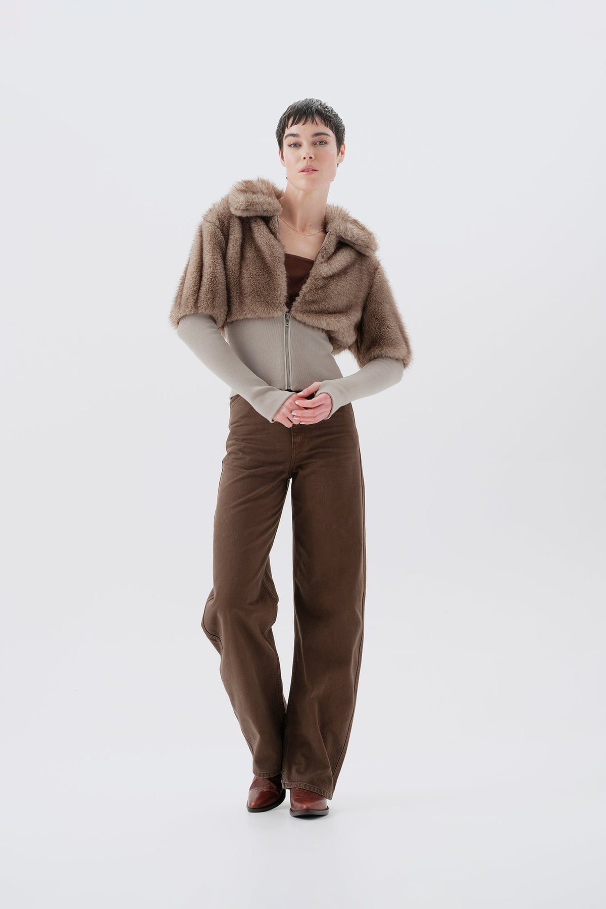 Cropped beige and gray faux fur jacket with statement collar and ribbed knit trim at waist and cuffs