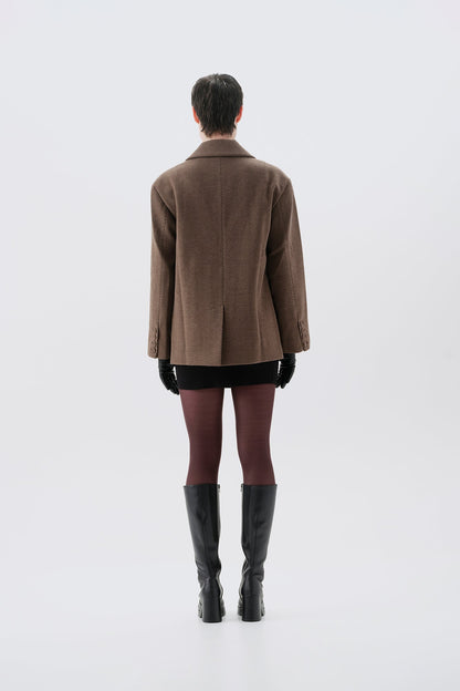 Brown oversized blazer with shoulder pads, back view
