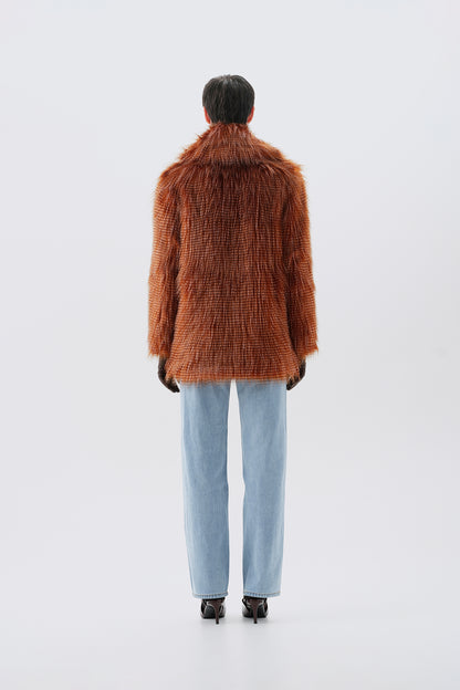 Model pictured from the back  wearing a brown faux fur coat with a white background